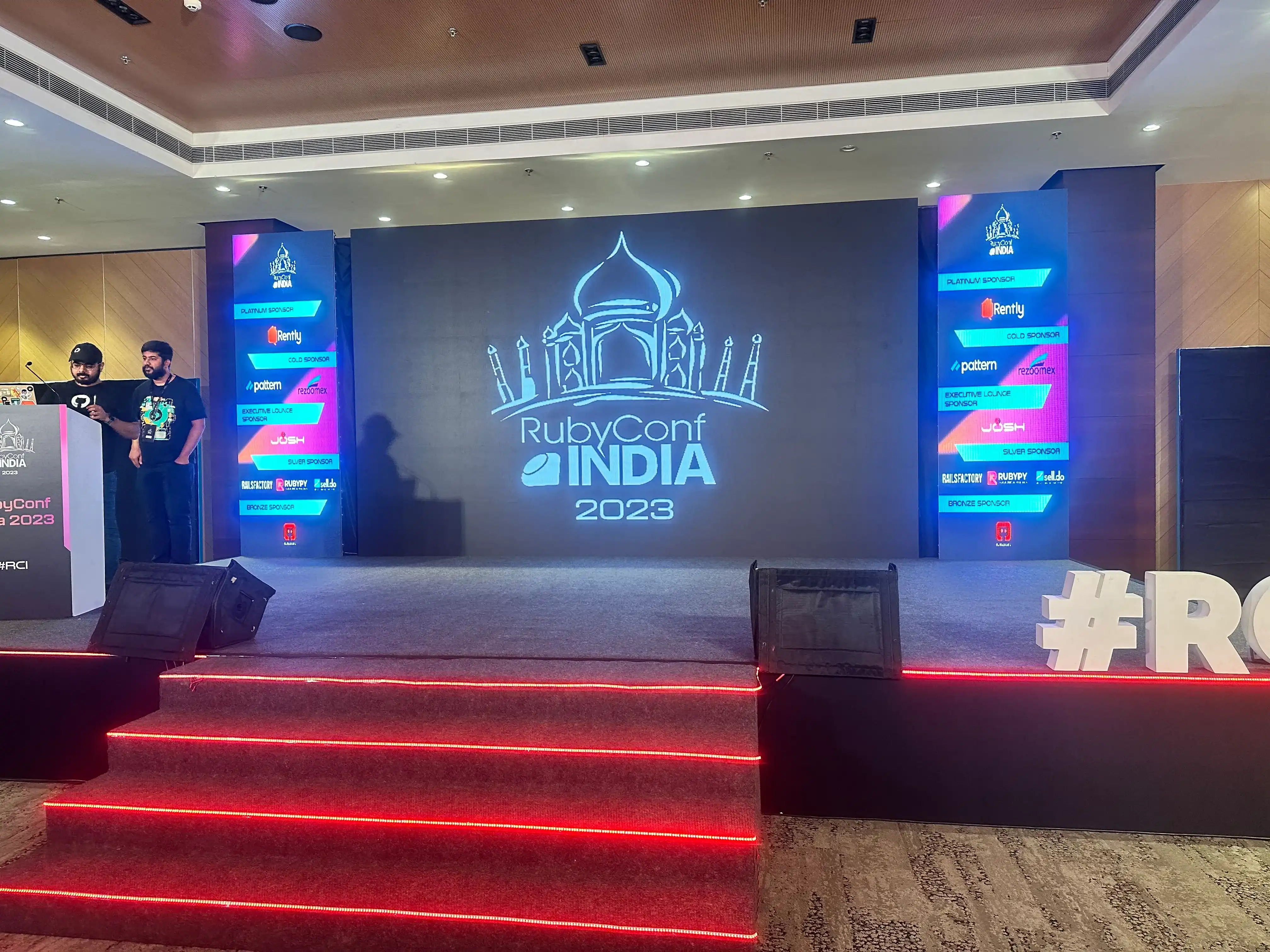 Two men took the stage at RubyConf India 2023