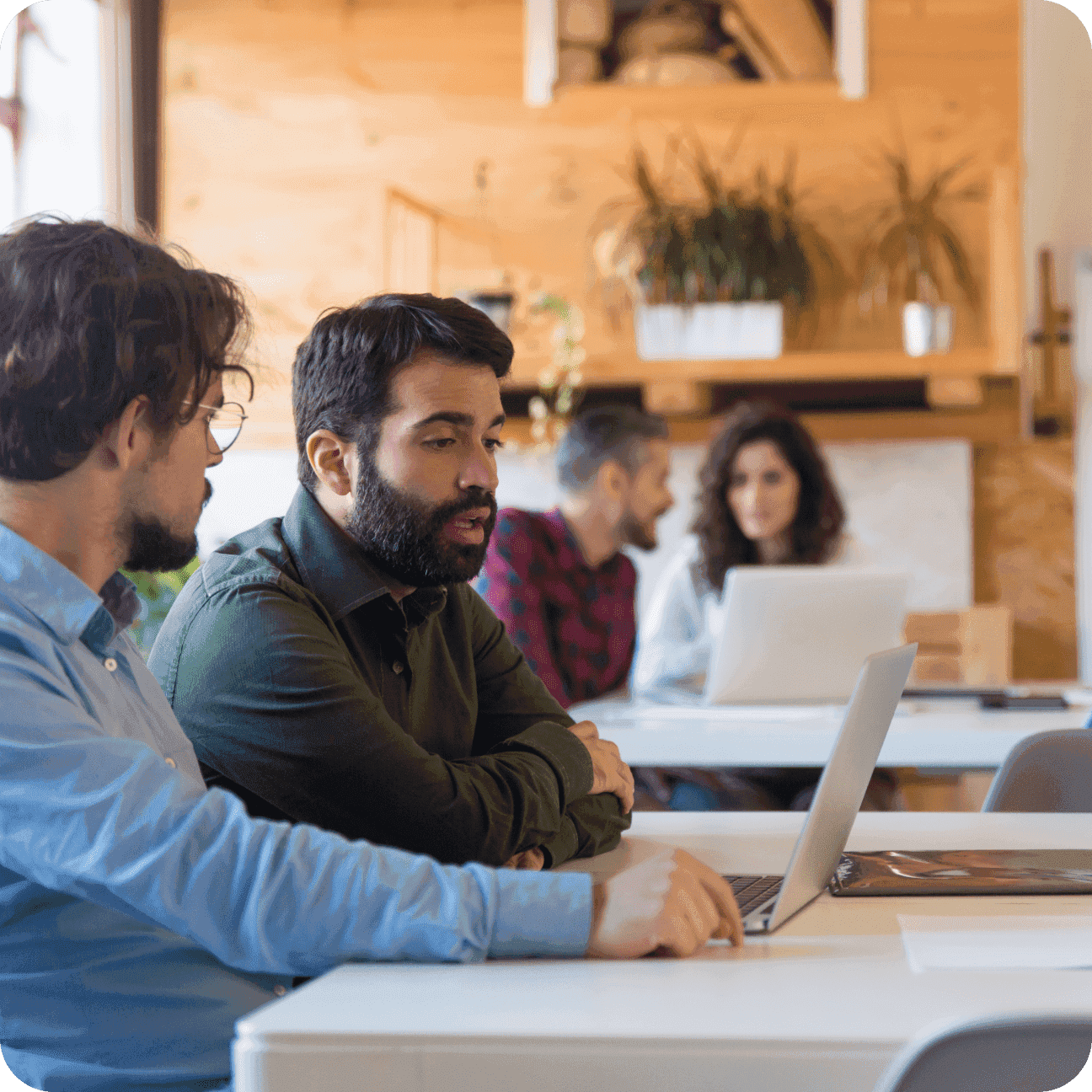 People working on laptop collaboratively